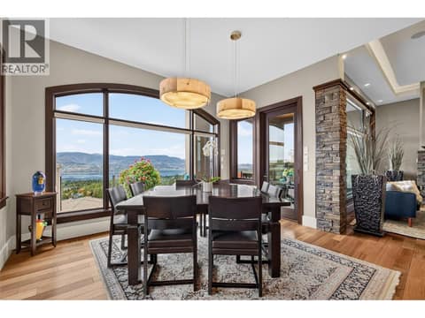 Dining framed by the view at 734 Marin Crescent, Upper Mission, Kelowna