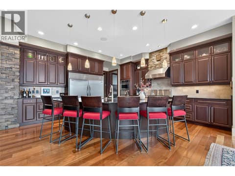 Generous island seating for 6 at 734 Marin Crescent, Upper Mission, Kelowna