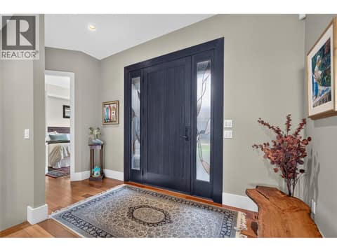 Grand foyer looks right through to the lake at 734 Marin Crescent, Upper Mission, Kelowna