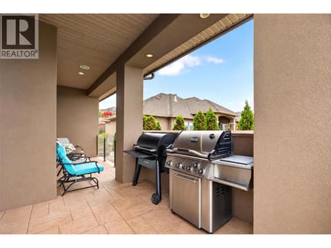 Providing a separated space for outdoor cooking at 734 Marin Crescent, Upper Mission, Kelowna