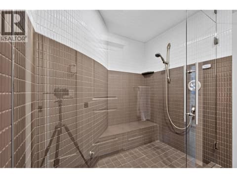 With a massive shower accessed by both bedrooms at 734 Marin Crescent, Upper Mission, Kelowna