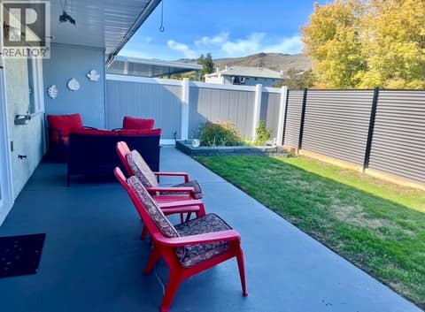 Useable North facing patio, raised flower beds on either side with fully fenced private yard. at 3900 27 Avenue Unit# 74, Westmount, Vernon