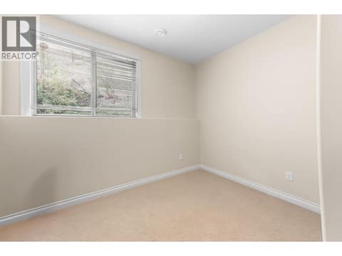 Main floor 1st bedroom at 550 Glenmeadows Road Unit# 100, Glenmore, Kelowna