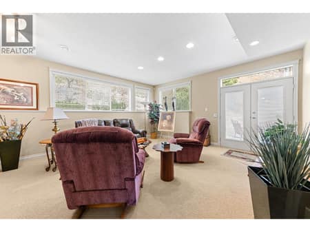 Main floor rec/family room with access to the yard at 550 Glenmeadows Road Unit# 100, Glenmore, Kelowna