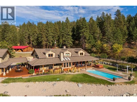 Overview of the  House and Pool  with Barn in the background at 5705 Upper Booth N Road, Ellison, Kelowna