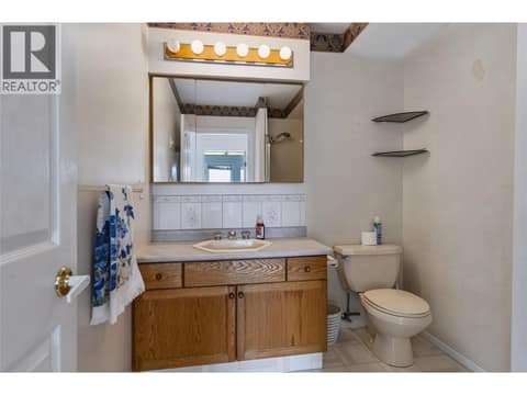 3 piece bathroom next to laundry and entrance to the garage. at 3925 North Naramata Road, Naramata Rural