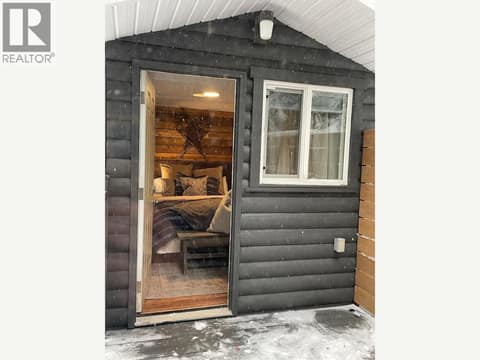 Detached bunkie with open doorway at 1166 Apex Mountain Road, Penticton Apex
