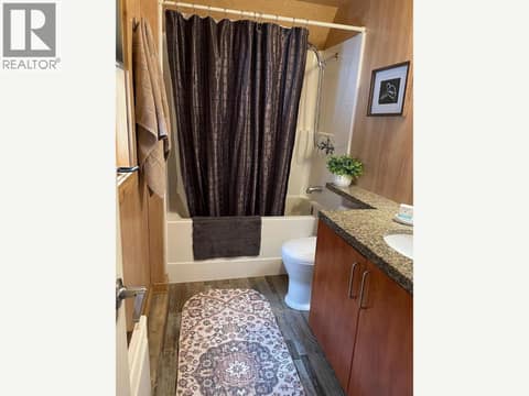 Full bathroom with tub-shower combination and vanity at 1166 Apex Mountain Road, Penticton Apex