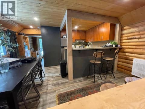 Kitchen breakfast bar beside the dining area at 1166 Apex Mountain Road, Penticton Apex