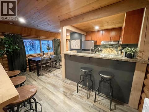 Kitchen peninsula and adjacent dining nook at 1166 Apex Mountain Road, Penticton Apex