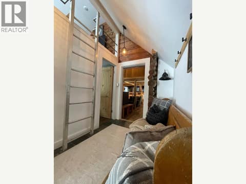Loft access above built-in hallway seating at 1166 Apex Mountain Road, Penticton Apex