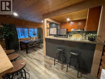 Open-plan kitchen, dining area, and living room at 1166 Apex Mountain Road, Penticton Apex