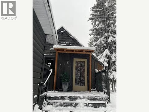 Snow-covered entry vestibule and steps at 1166 Apex Mountain Road, Penticton Apex