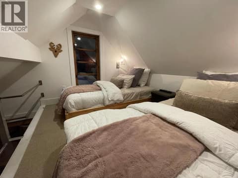 Upper sleeping loft with four beds at 1166 Apex Mountain Road, Penticton Apex