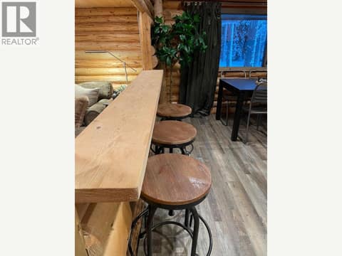 Wood breakfast ledge with bar stools at 1166 Apex Mountain Road, Penticton Apex