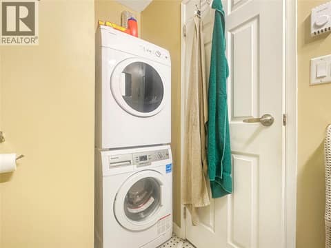 Laundry behind door in main bath at 337 MCKINNEY Road Unit# 211, Oliver