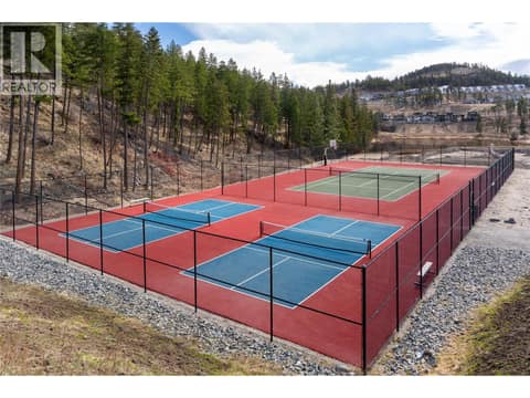 Walk to the tennis and pickleball courts at 1960 Northern Flicker Court Unit# 7, McKinley Landing, Kelowna