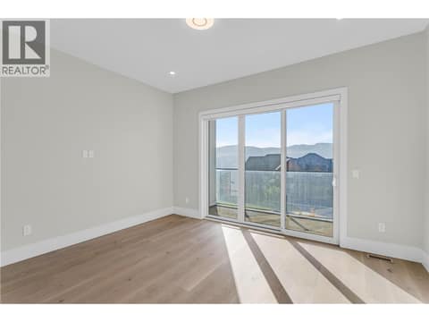 Bedroom #3 with access to deck at 1579 Malbec Place, Lakeview Heights, West Kelowna