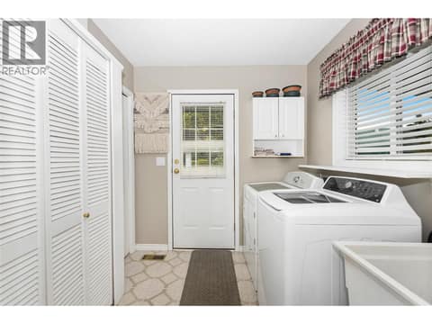 Laundry room/mechanical room at 3300 Becker Street, Armstrong/ Spall.