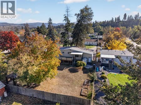 Large & flat yard at 1420 Graham Road, Rutland South, Kelowna