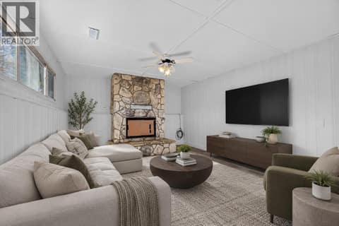 Living/recreation room on the lower level *virtually staged* at 1420 Graham Road, Rutland South, Kelowna