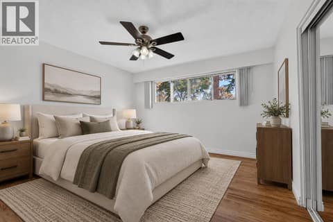 Primary bedroom on the upper level *virtually staged* at 1420 Graham Road, Rutland South, Kelowna
