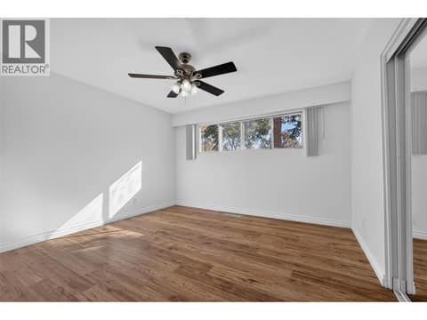 Primary bedroom on the upper level at 1420 Graham Road, Rutland South, Kelowna