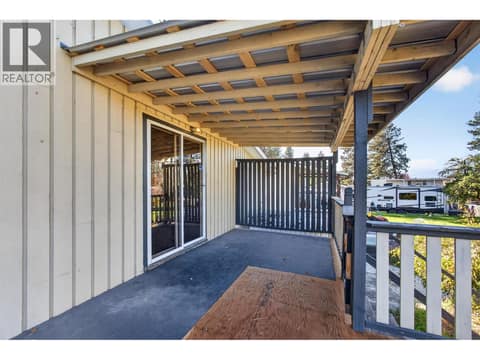 Upper level deck with stairs to the backyard at 1420 Graham Road, Rutland South, Kelowna