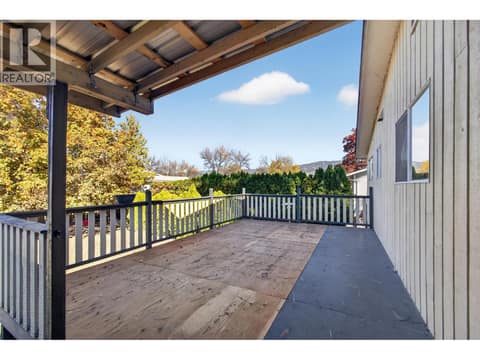 Upper level deck with stairs to the backyard at 1420 Graham Road, Rutland South, Kelowna