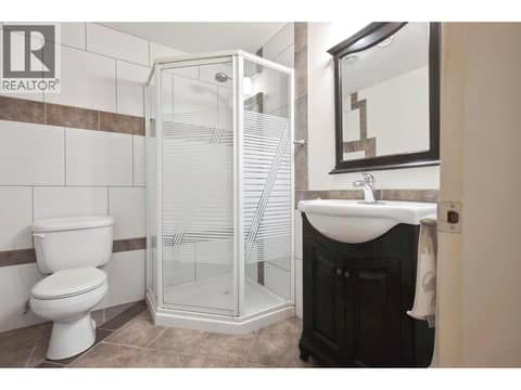 Full bathroom on lower level at 183 Magic Drive, Glenmore, Kelowna