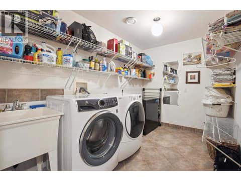 Spacious laundry on lower level at 183 Magic Drive, Glenmore, Kelowna