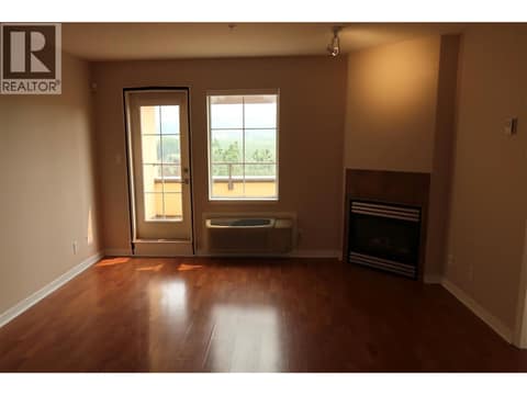 Gas fireplace and space for a large sectional or two sofas. at 7600 COTTONWOOD Drive Unit# 404, Osoyoos