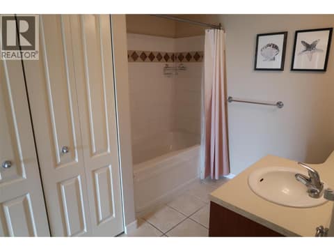 Large bathroom with ensuite access, double door for guests. at 7600 COTTONWOOD Drive Unit# 404, Osoyoos