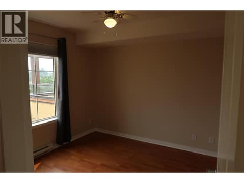 Large bedroom with sweeping vineyard views. at 7600 COTTONWOOD Drive Unit# 404, Osoyoos