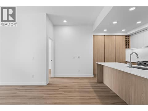 Kitchen and Entry to Primary Suite - Photos of a similar home in the community. at 2760 Olalla Road Unit# 208, Lakeview Heights, West Kelowna