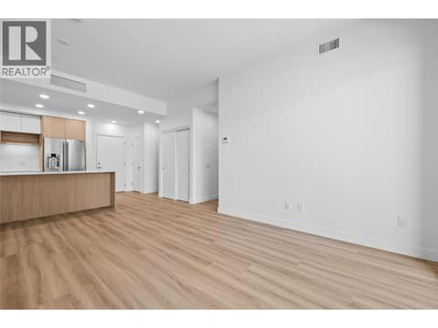Living Room and Kitchen - Photos of a similar home in the community. at 2760 Olalla Road Unit# 208, Lakeview Heights, West Kelowna
