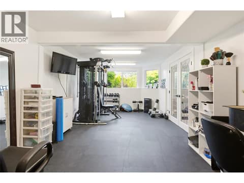 Flexible Bonus Room, Currently a Home Gym and Salon, Easily Adapted as an Office or Additional Bedroom at 724 Lone Pine Drive, Black Mountain, Kelowna