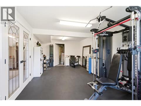 Flexible Bonus Room, Currently a Home Gym and Salon, Easily Adapted as an Office or Additional Bedroom at 724 Lone Pine Drive, Black Mountain, Kelowna
