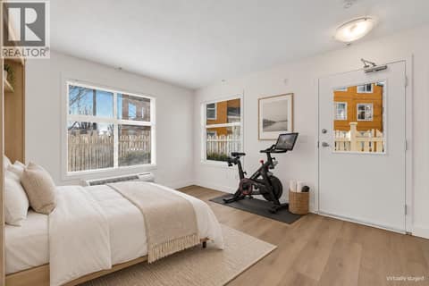Virtually staged murphy bed + peleton at 533 Yates Road Unit# 100, North Glenmore, Kelowna