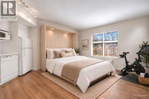 Virtually staged option with murphy bed + peleton at 533 Yates Road Unit# 100, North Glenmore, Kelowna