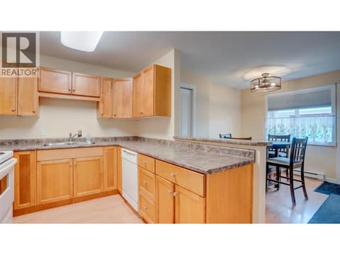 Kitchen facing dining area at 4740 20 Street Unit# 99, Harwood, Vernon