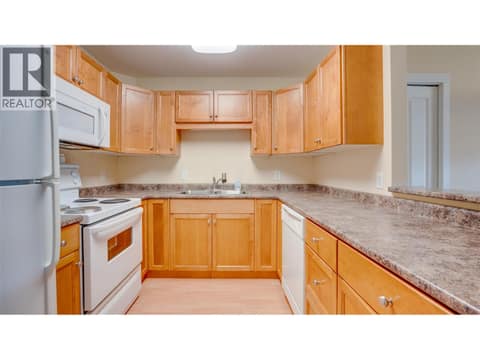 Kitchen with updated lighting at 4740 20 Street Unit# 99, Harwood, Vernon