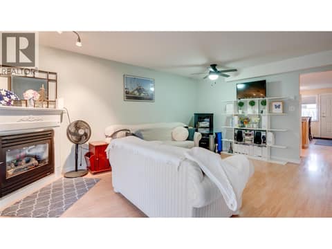 Living room with natural gas fireplace at 4740 20 Street Unit# 99, Harwood, Vernon