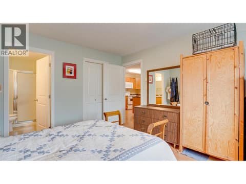 Primary bedroom facing ensuite and walk-in closet at 4740 20 Street Unit# 99, Harwood, Vernon