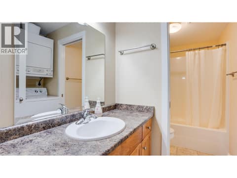 Second 4-piece bathroom and laundry room at 4740 20 Street Unit# 99, Harwood, Vernon
