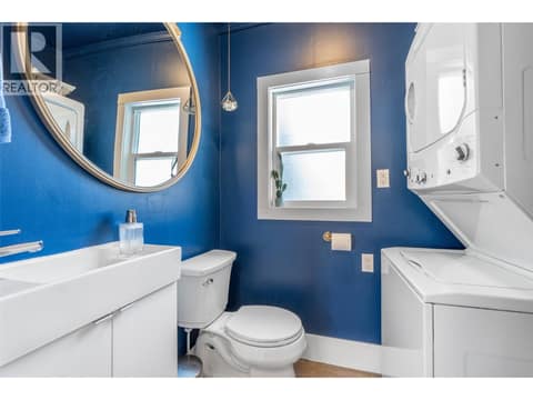 2-piece bathroom with laundry between living room & kitchen at 860 Fairview Road, Oliver