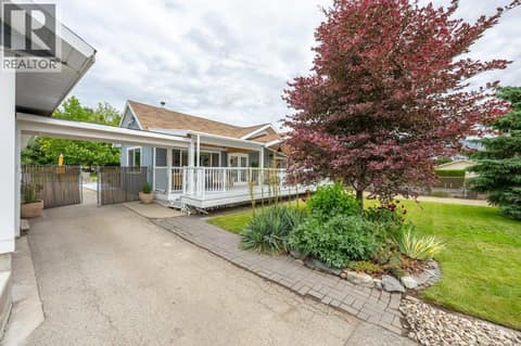 Breezeway between garage and front porch at 860 Fairview Road, Oliver