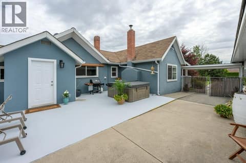 Courtyard facing main house & hot tub at 860 Fairview Road, Oliver