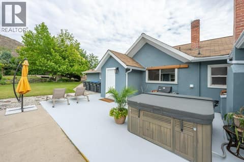 Courtyard facing main house & hot tub at 860 Fairview Road, Oliver