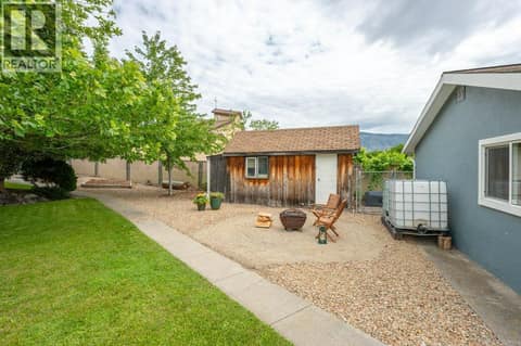 Fire pit & wood shed at 860 Fairview Road, Oliver